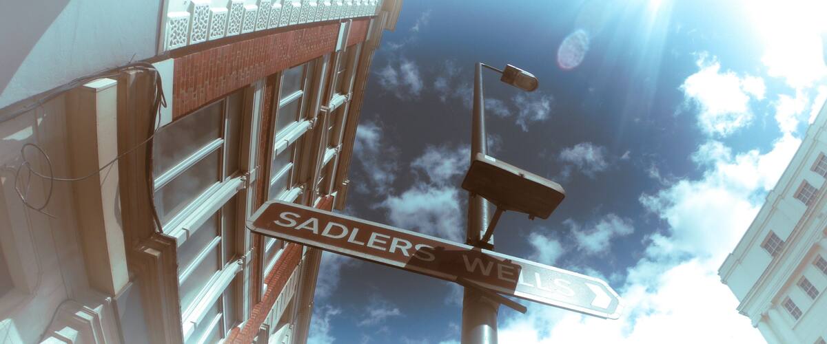 Low angle shot of the Sadlers Wells Theatre sign captured on a sunny day in London, UK