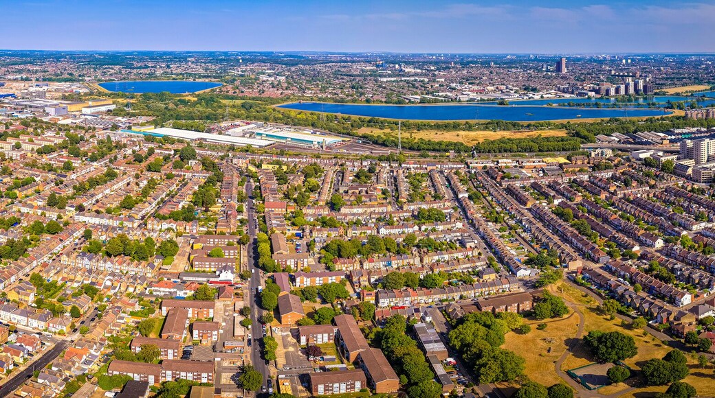 Aerial view of Tottenham Hotspur Stadium in London, showcasing its modern architecture and football pitch