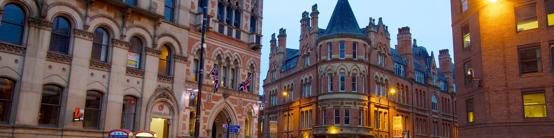 Albert Square which includes a city, street scenes and a square or plaza