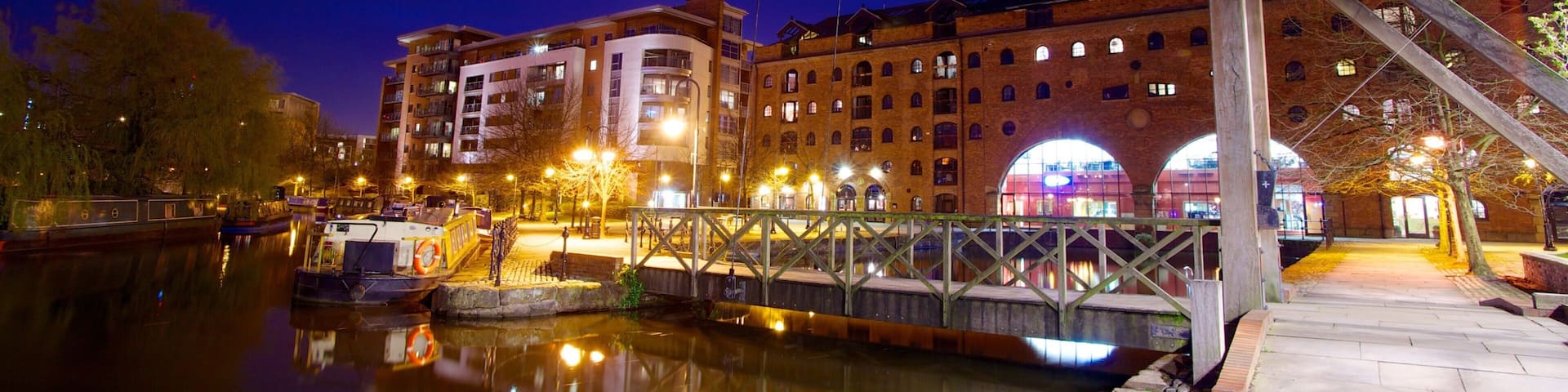 Castlefield Roman Fort featuring a bay or harbor, a bridge and night scenes