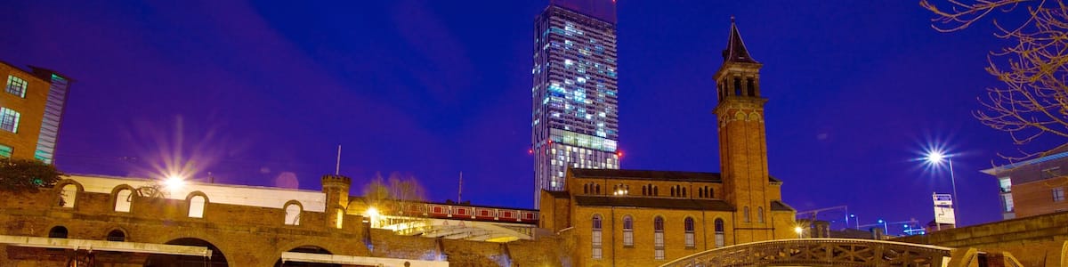 Castlefield Roman Fort which includes a river or creek, night scenes and a castle