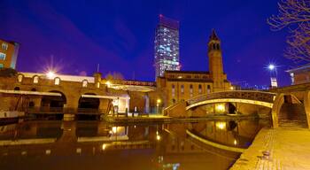 Castlefield Roman Fort which includes a river or creek, night scenes and a city