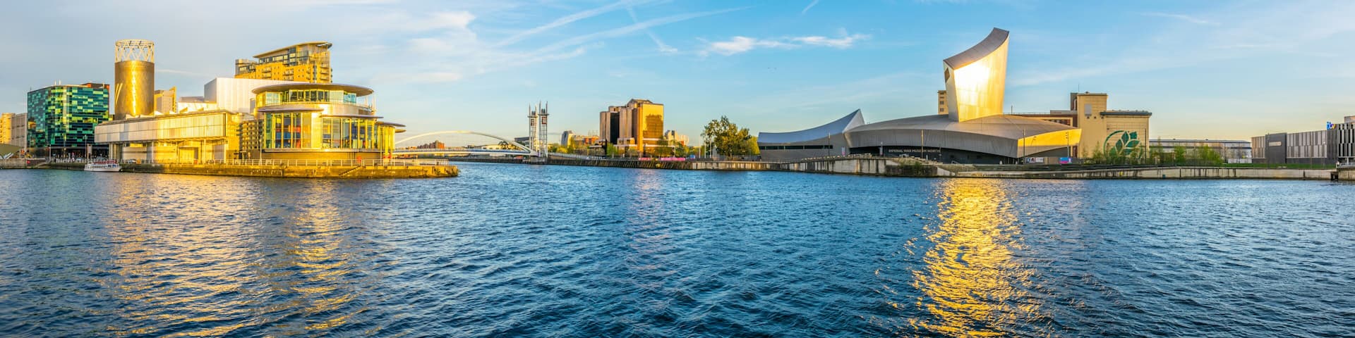 Imperial war museum North and the lowry theater in Manchesterduring sunset, England