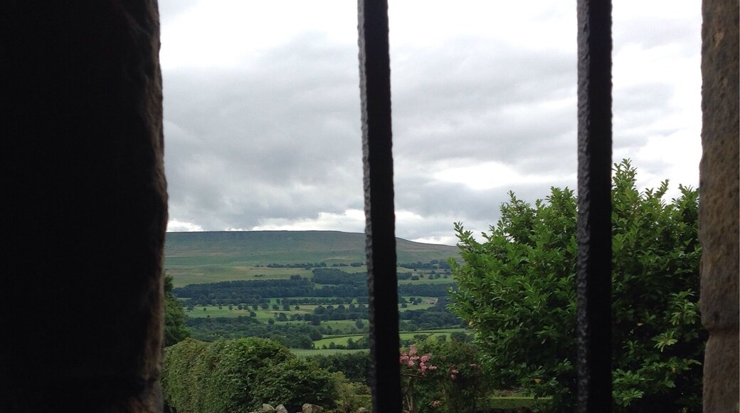 View of the Yorkshire gardens and countryside through the window at Bolton Castle