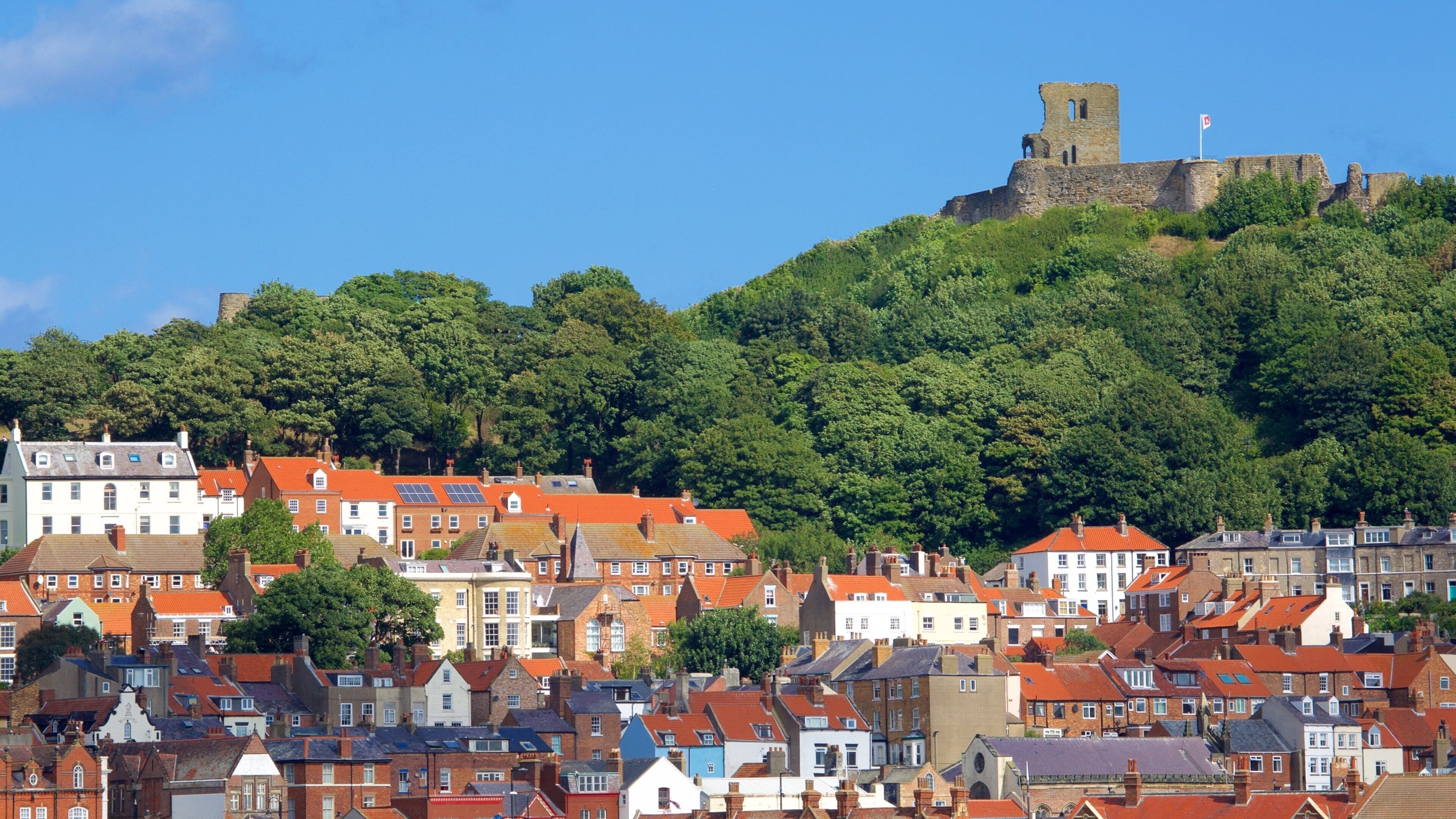 Scarborough Castle showing a small town or village, a ruin and chateau or palace