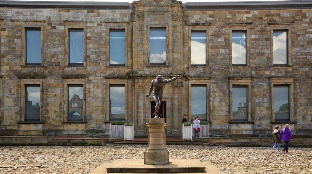 Whitby Abbey featuring a statue or sculpture and heritage elements