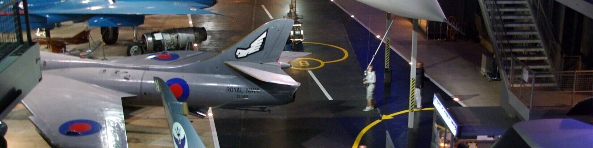 The Fleet Air Arm Museum is devoted to the history of British naval aviation. It has an extensive collection of military and civilian aircraft, aero engines, models of aircraft and Royal Navy ships (especially aircraft carriers), and paintings and drawings related to naval aviation. It is located on RNAS Yeovilton airfield, and the museum has viewing areas where visitors can watch military aircraft (especially helicopters) take off and land. It is located 7 miles (11 km) north of Yeovil, and 40 miles (64 km) south of Bristol.