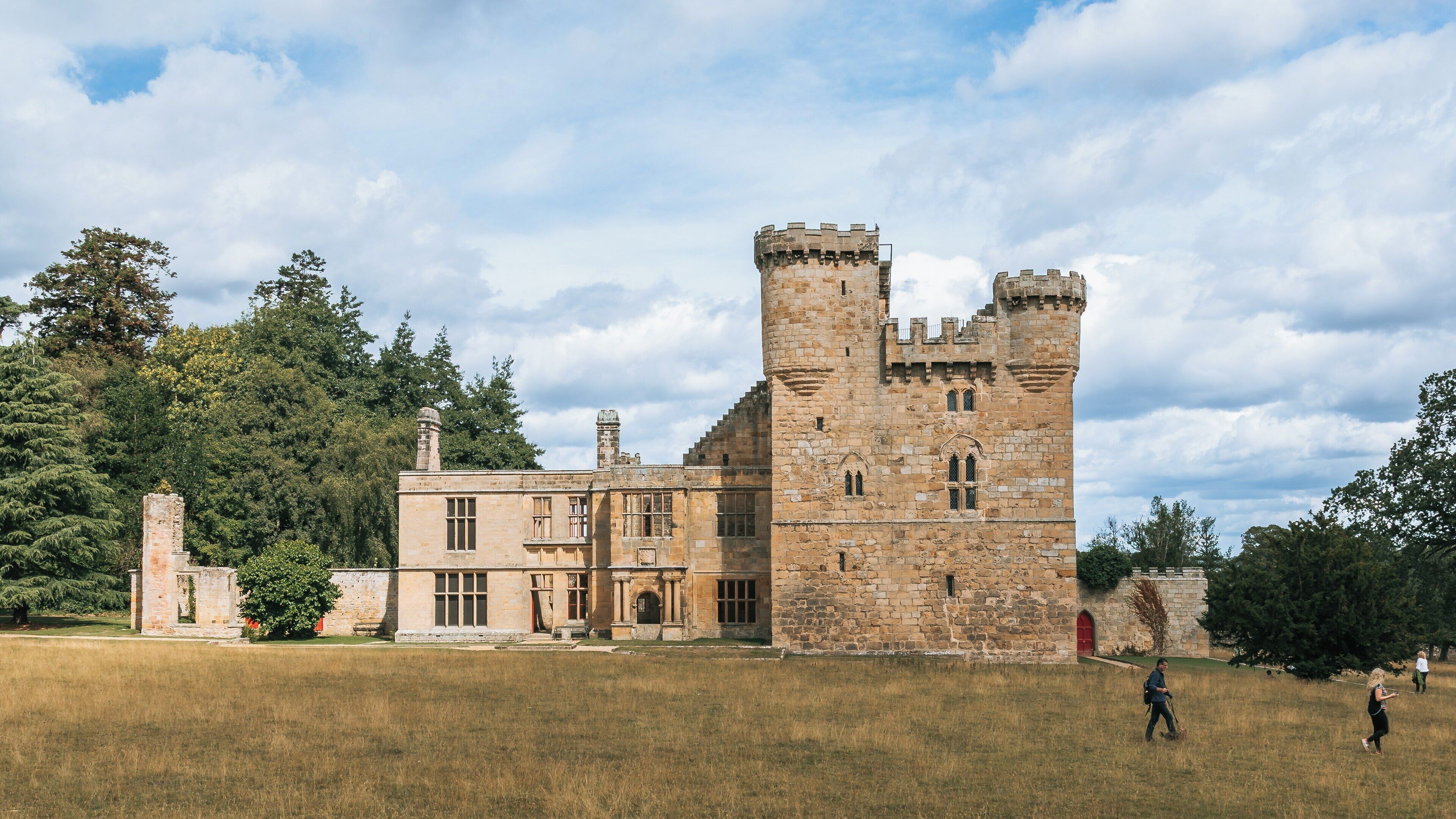 Exploring the historical architecture of Belsay Hall and its extensive gardens in Newcastle-upon-Tyne, England during a sunny day