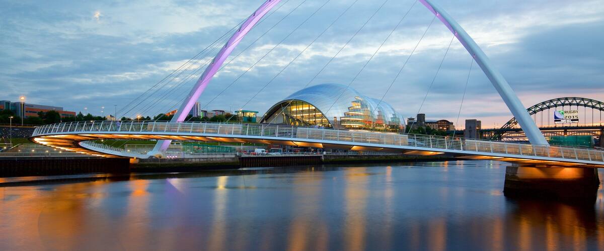 Gateshead Millennium Bridge showing a bridge, modern architecture and a river or creek