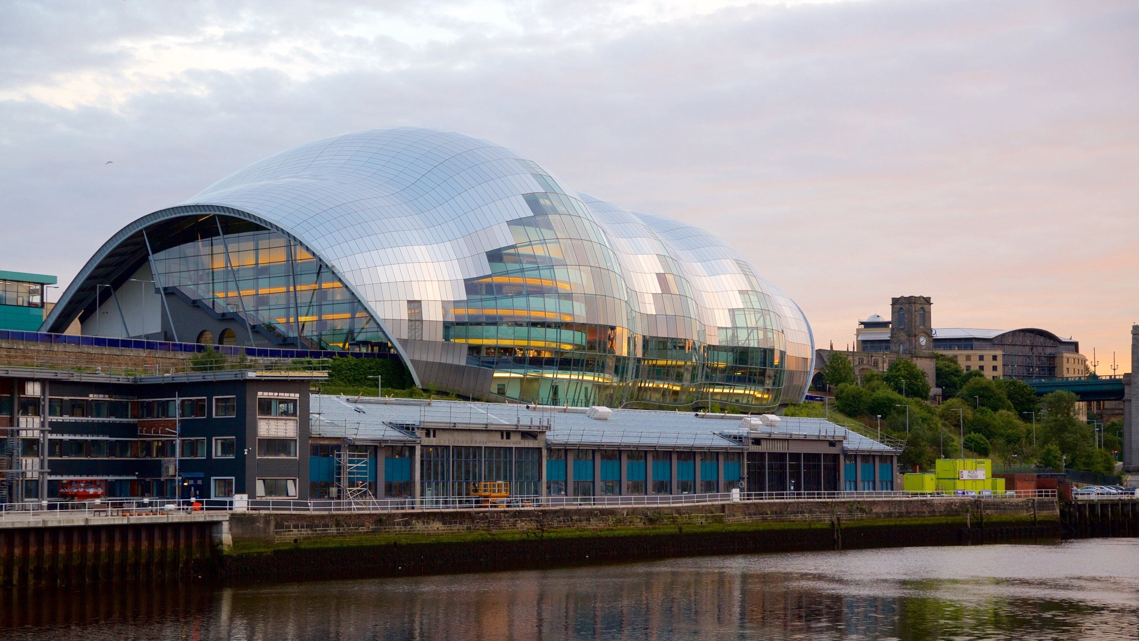 Sage Gateshead showing a river or creek, a city and modern architecture