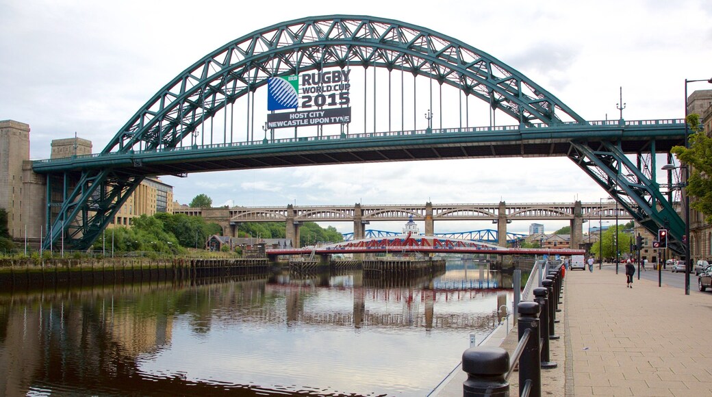 Tyne Bridge which includes signage, a bridge and a river or creek