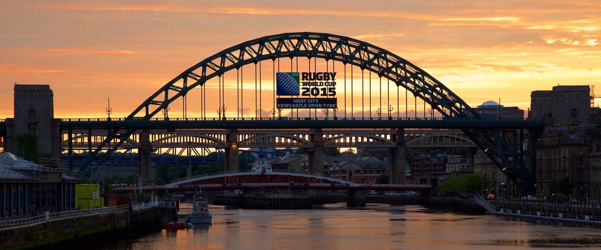 Tyne Bridge showing a city, a river or creek and signage
