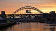 Tyne Bridge showing a city, a river or creek and signage