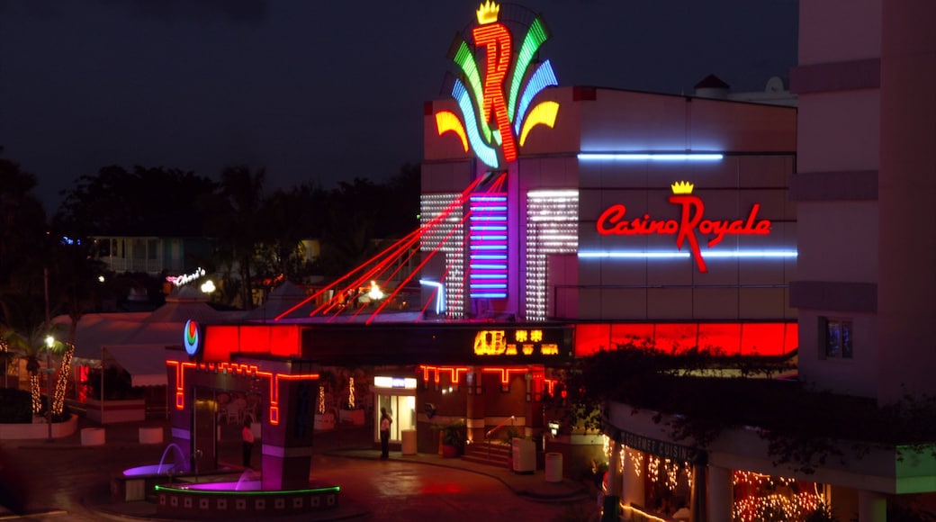 Casino Royale featuring a casino, night scenes and signage