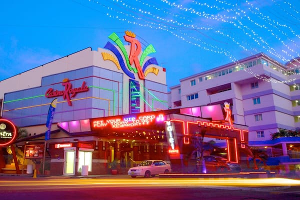 Casino Royale featuring signage, street scenes and a city