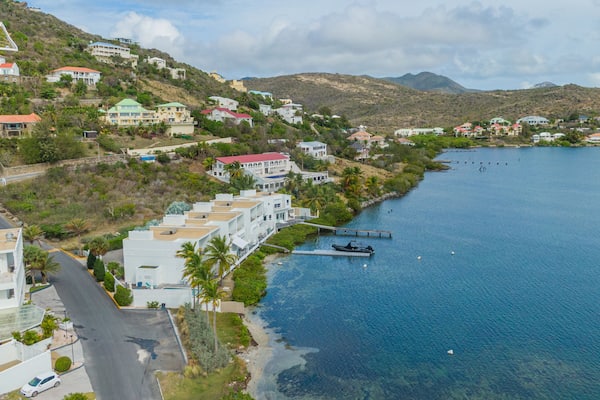 Dawn Beach which includes general coastal views and a coastal town