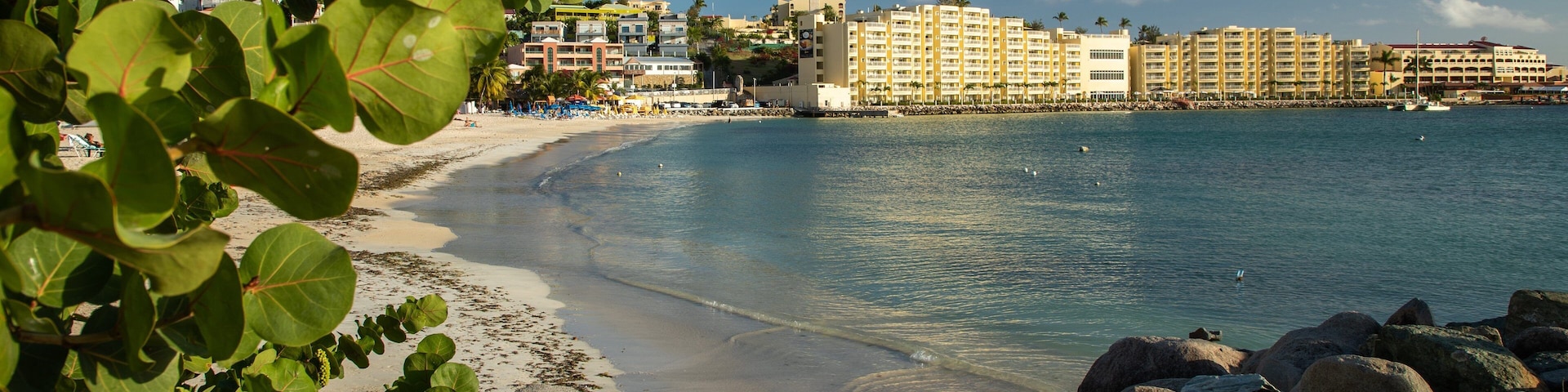 Kim Sha Beach showing a coastal town, a sandy beach and general coastal views