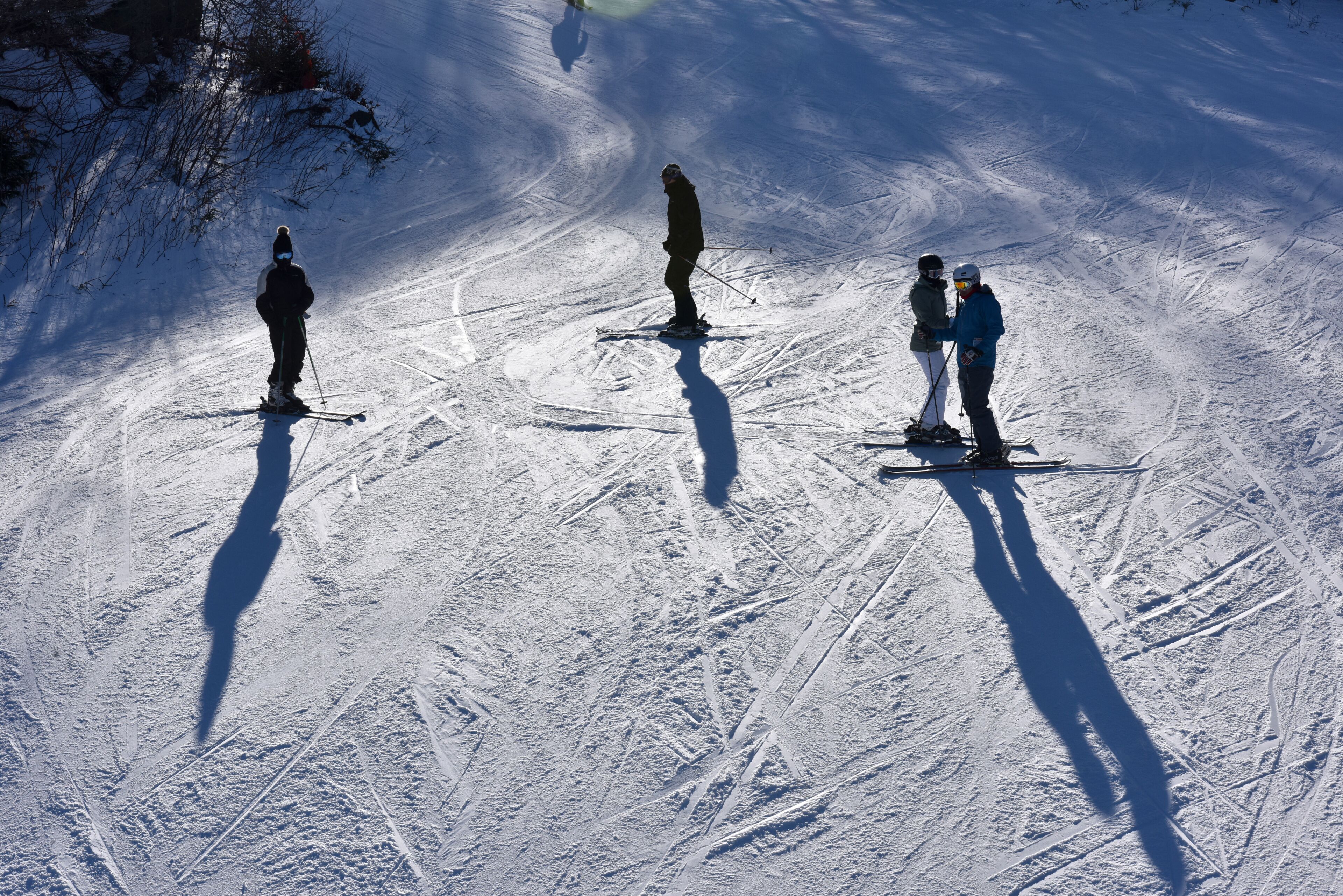 Unidentified skiers standing on the slopes at the Loon Mountain in New Hampshire, USA..
