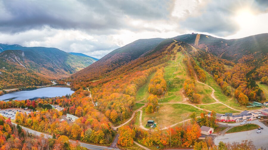 Aerial panorama of Franconia Notch State Park, the slopes of Mount Lafayette and Mount Cannon ski resort, above Echo Lake, in the fall season, in New Hampshire