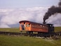 Cog Railway slowly creeping up Mount Washington. Picture was taking from the Appalachian Trail just below the mountain's peak.