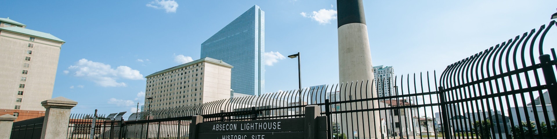 Absecon Lighthouse featuring a lighthouse and signage