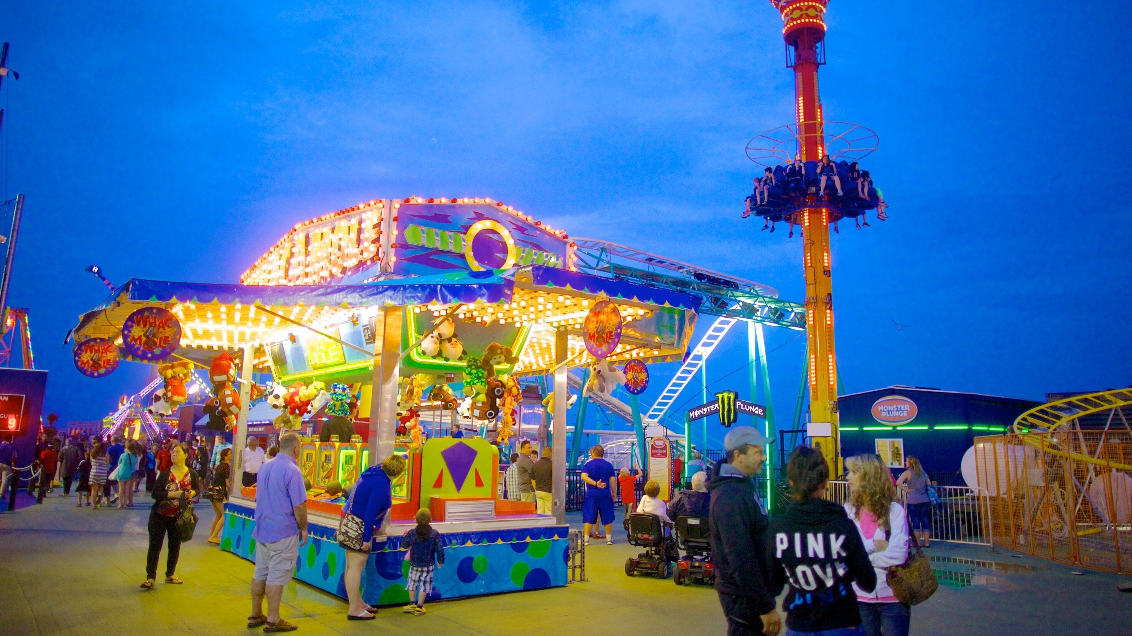 Steel Pier featuring nightlife, rides and street scenes