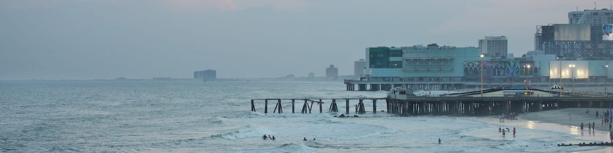 Steel Pier which includes general coastal views, a beach and a coastal town