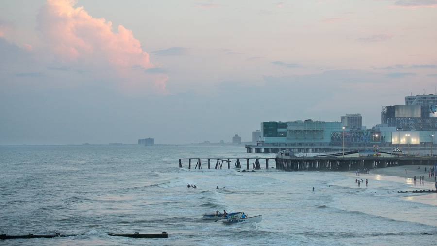 Steel Pier featuring a coastal town, a beach and general coastal views