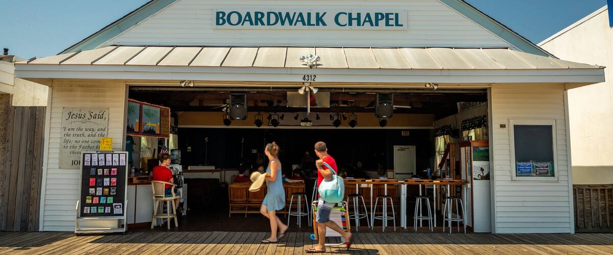 Boardwalk Chapel featuring signage as well as a couple