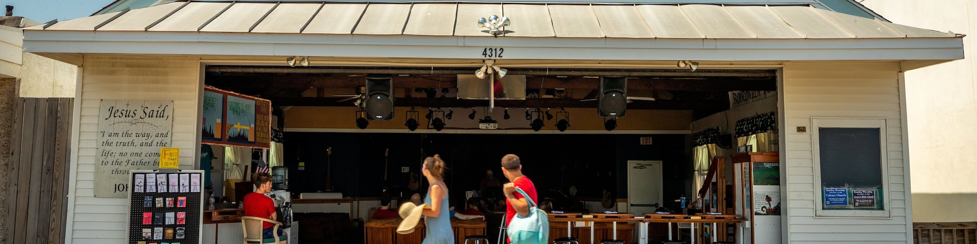 Boardwalk Chapel featuring signage as well as a couple