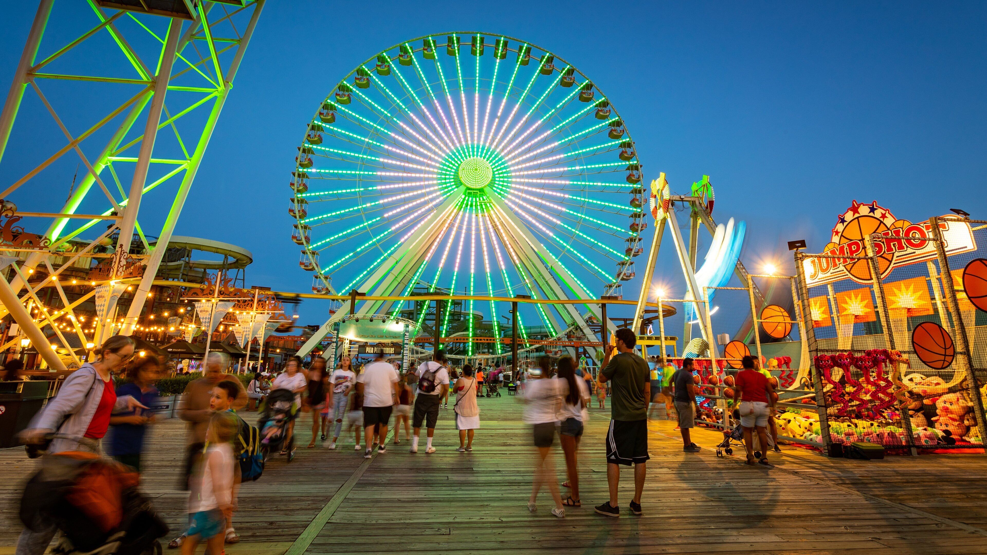 Mariner\'s Pier showing night scenes and rides as well as a large group of people