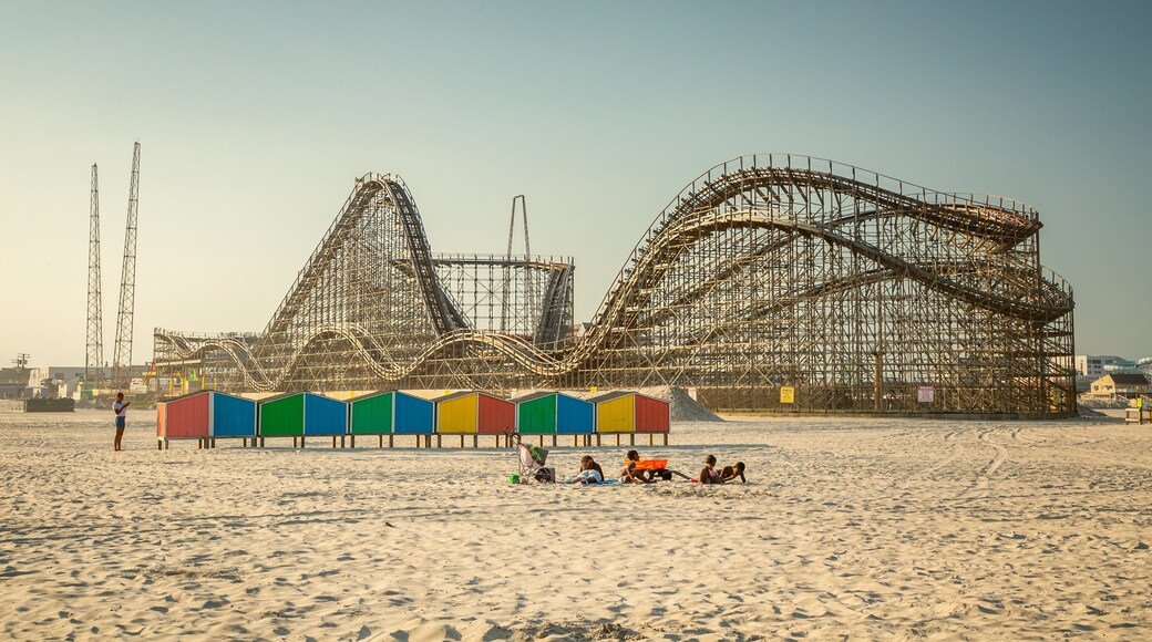 Wildwood Beach which includes a sandy beach and rides as well as a small group of people