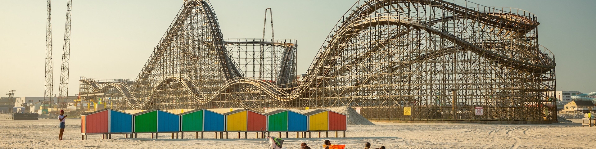 Wildwood Beach which includes a sandy beach and rides as well as a small group of people