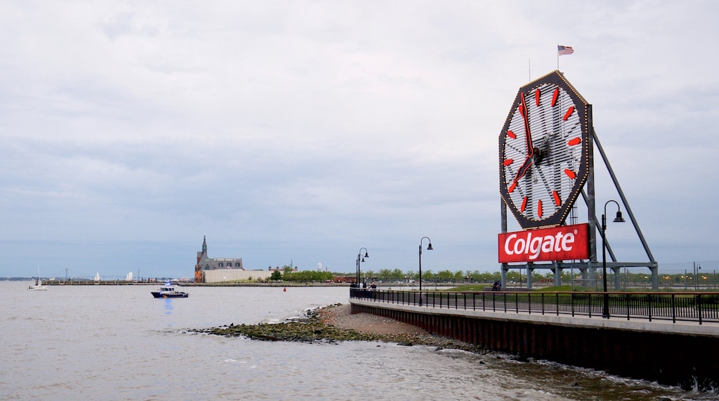 Colgate Clock featuring a bay or harbor and signage