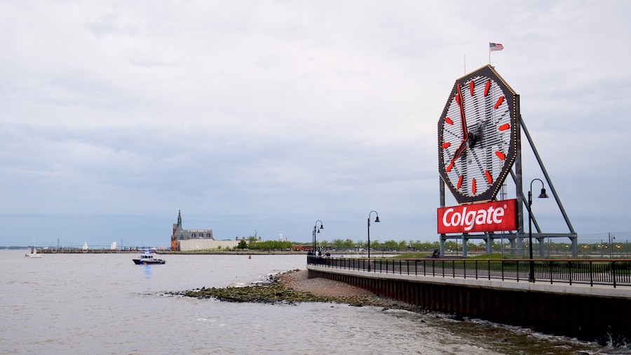 Colgate Clock featuring a bay or harbor and signage