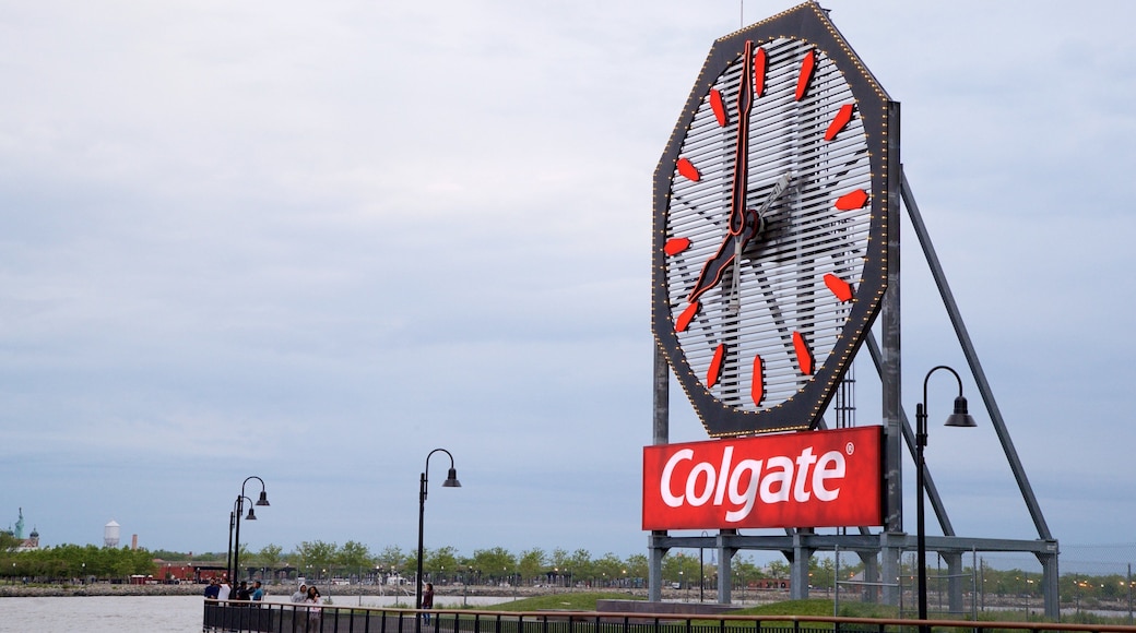 Colgate Clock featuring signage and a bay or harbour