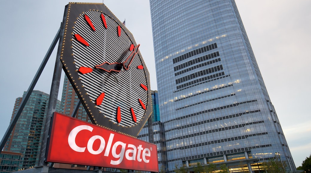 Colgate Clock featuring a city, signage and a high rise building