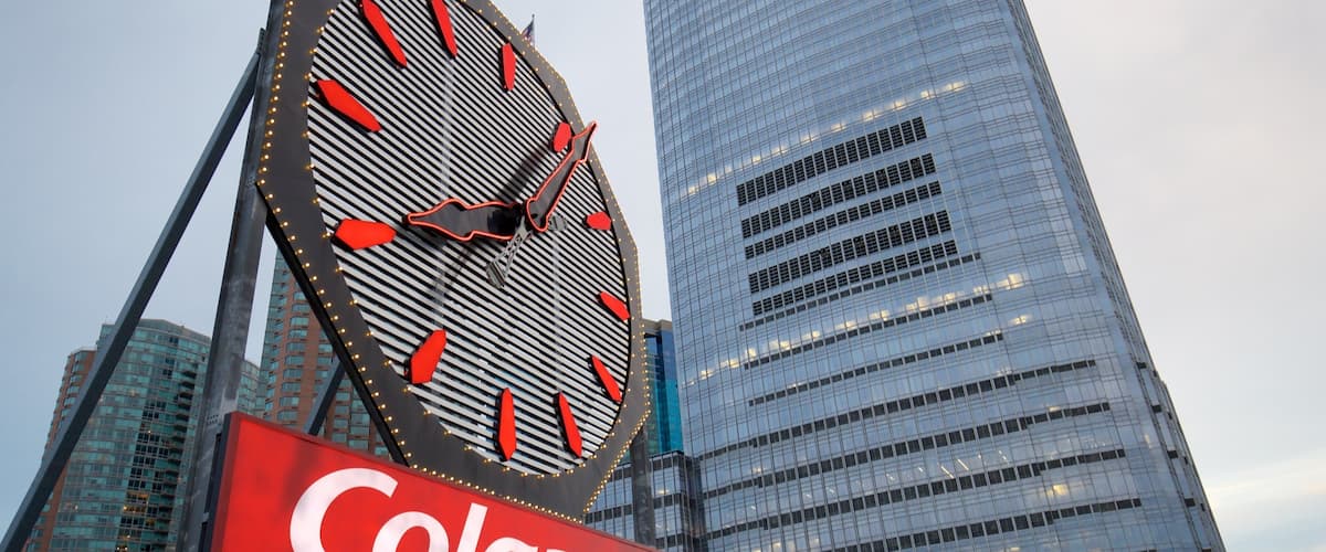 Colgate Clock featuring a city, signage and a high rise building