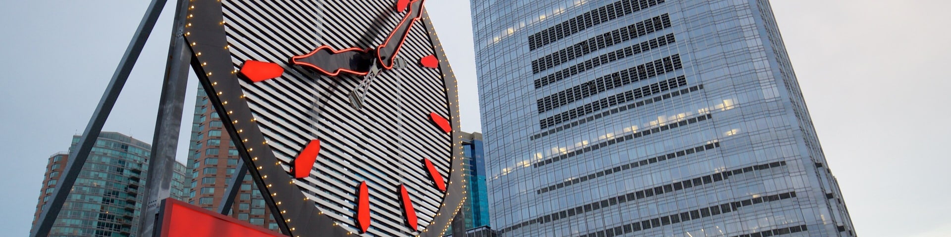 Colgate Clock featuring a city, signage and a high rise building
