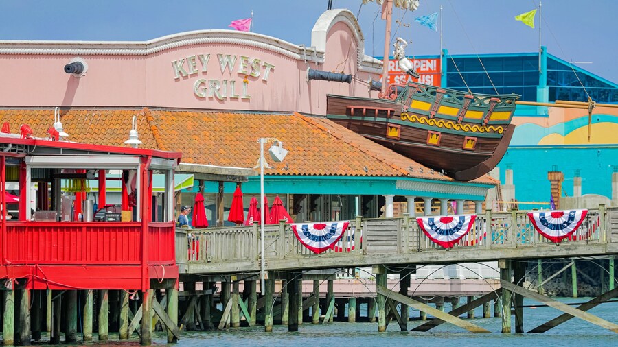 Broadway at the Beach showing a bay or harbor and signage