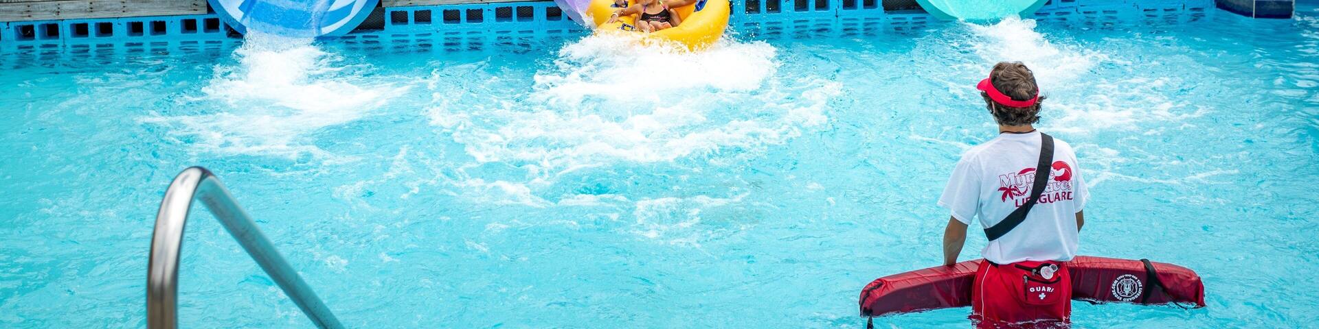 Myrtle Waves featuring a waterpark as well as a family