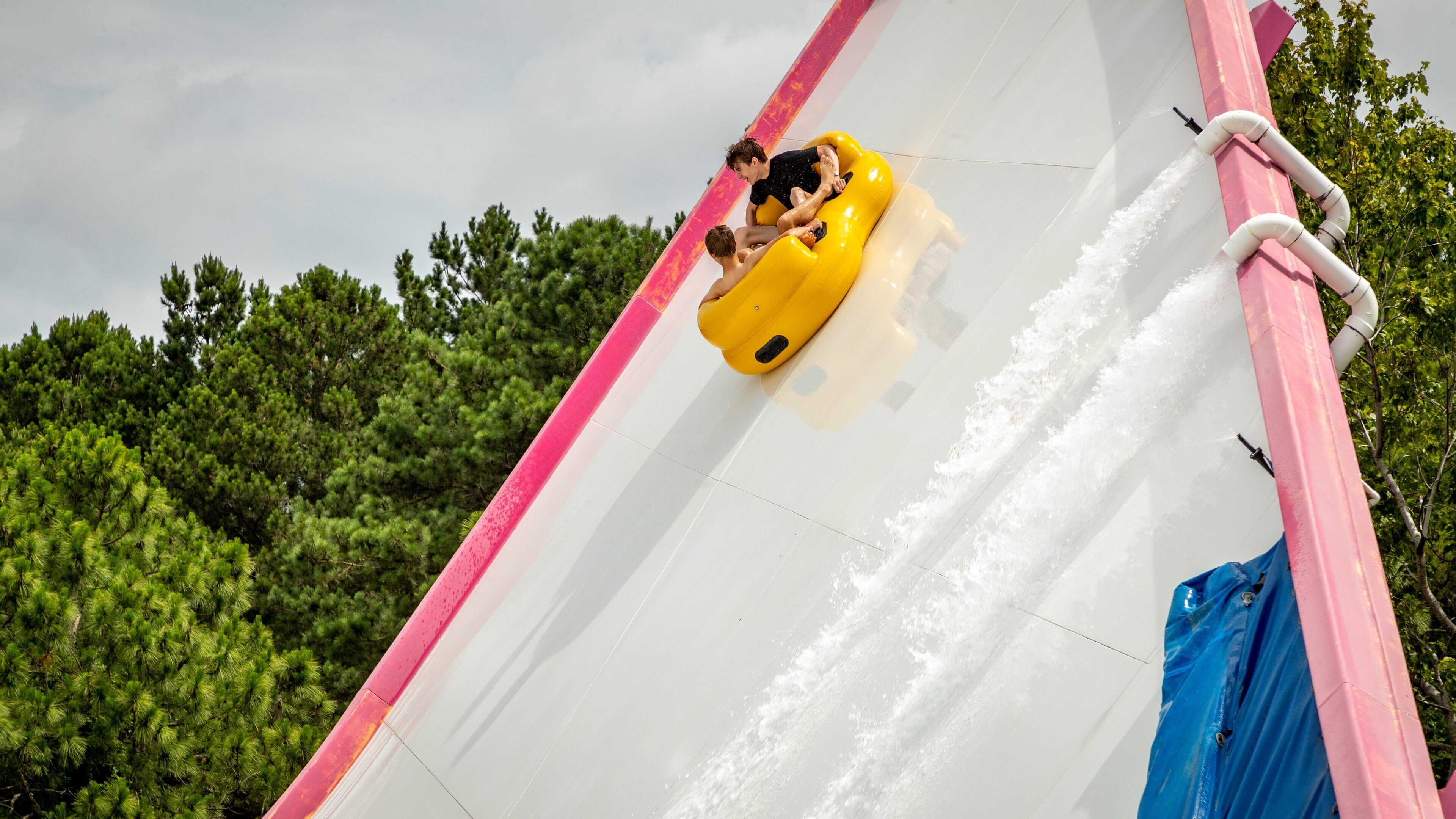 Myrtle Waves showing a waterpark as well as a couple