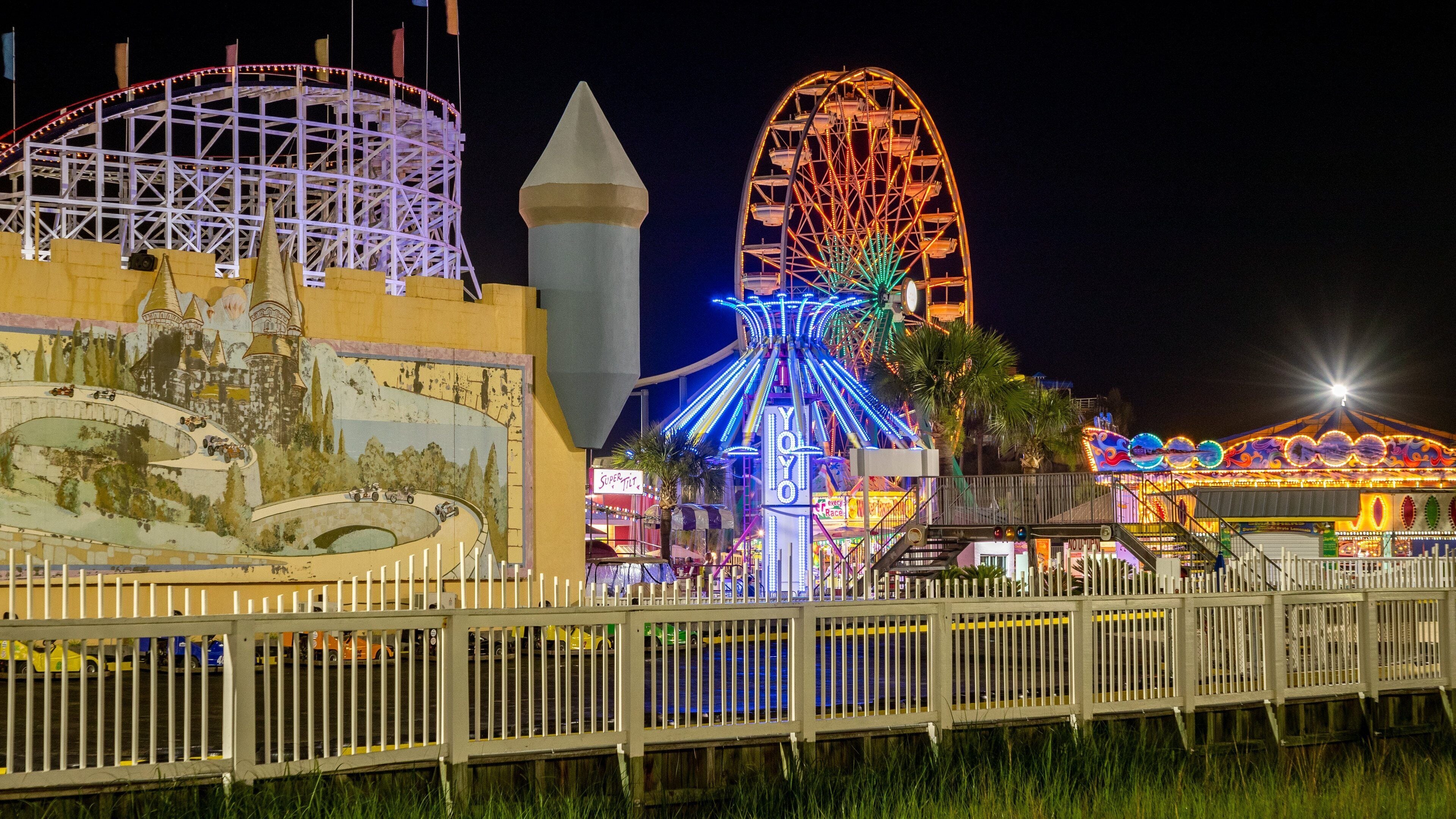 Family Kingdom Amusement Park which includes night scenes and rides