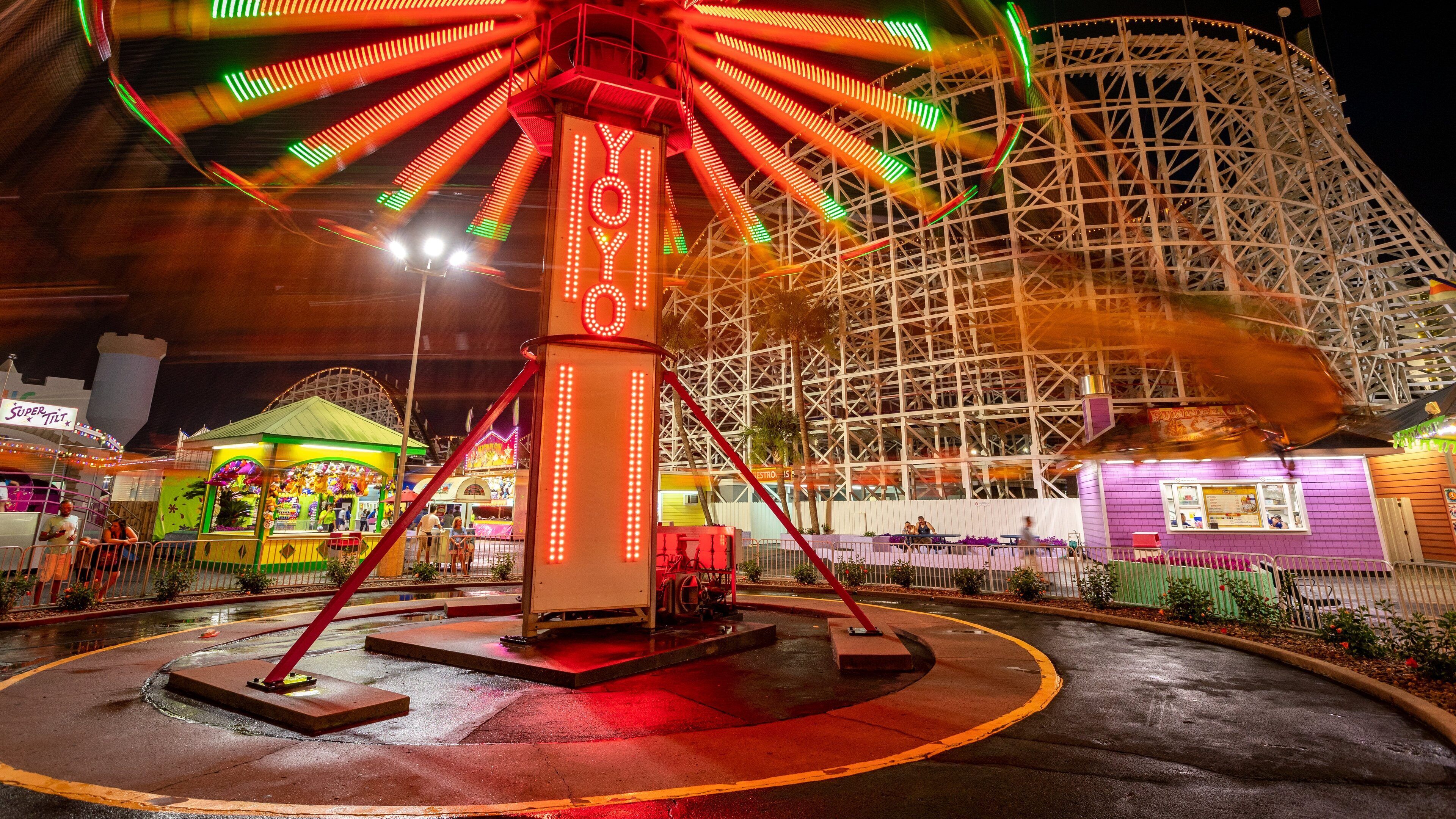 Family Kingdom Amusement Park which includes signage, rides and night scenes