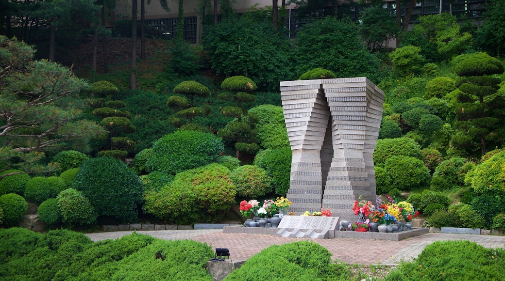 Seoul National University featuring a garden, flowers and outdoor art