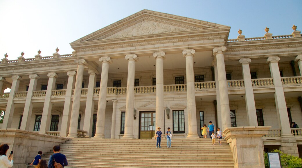 Deoksugung Palace which includes heritage architecture as well as a small group of people