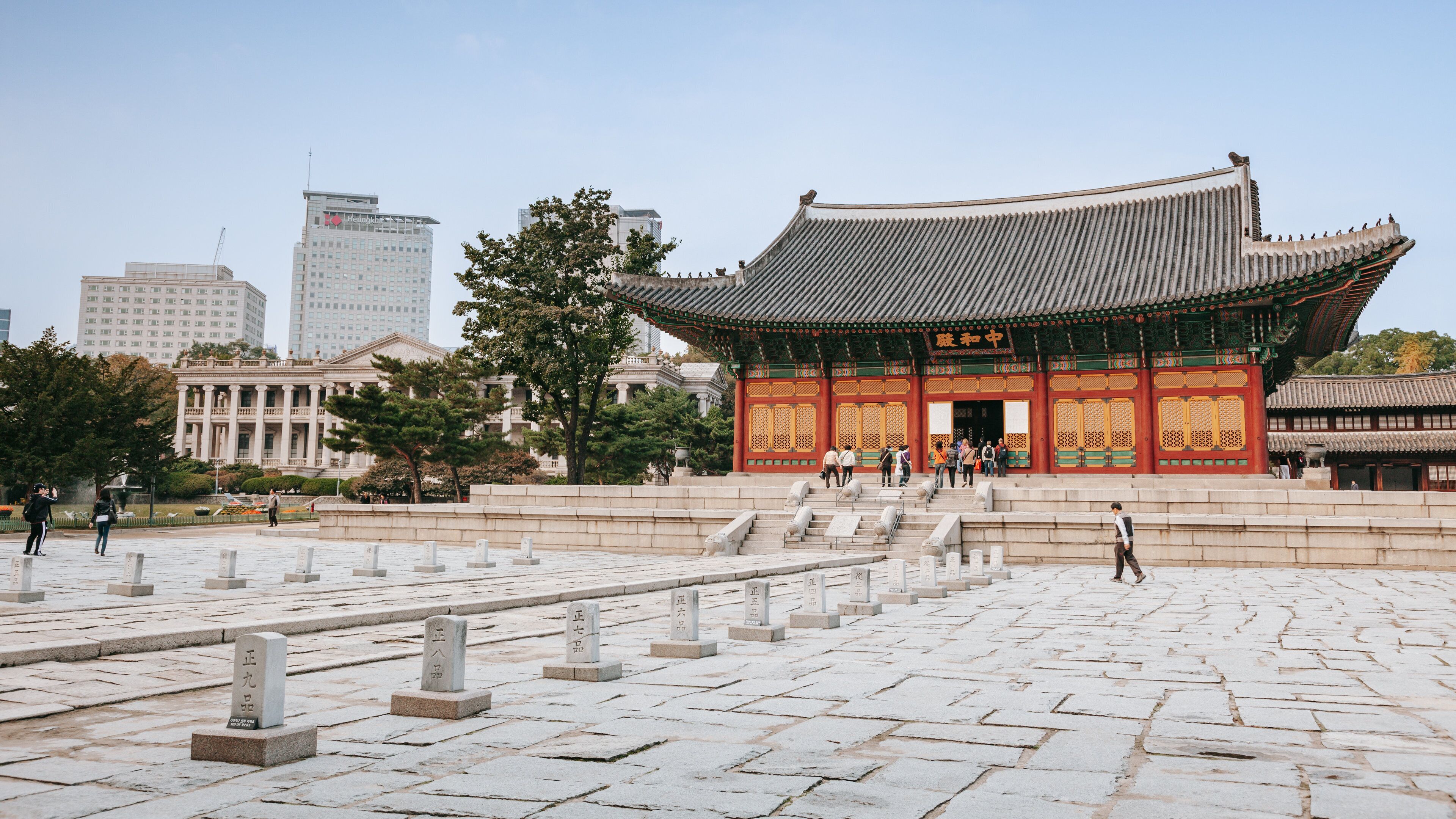 Deoksugung Palace featuring a temple or place of worship, heritage architecture and a square or plaza