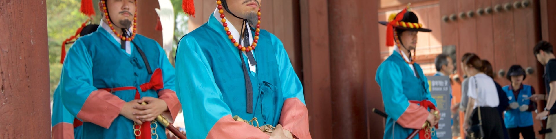 Deoksugung Palace which includes performance art as well as a small group of people
