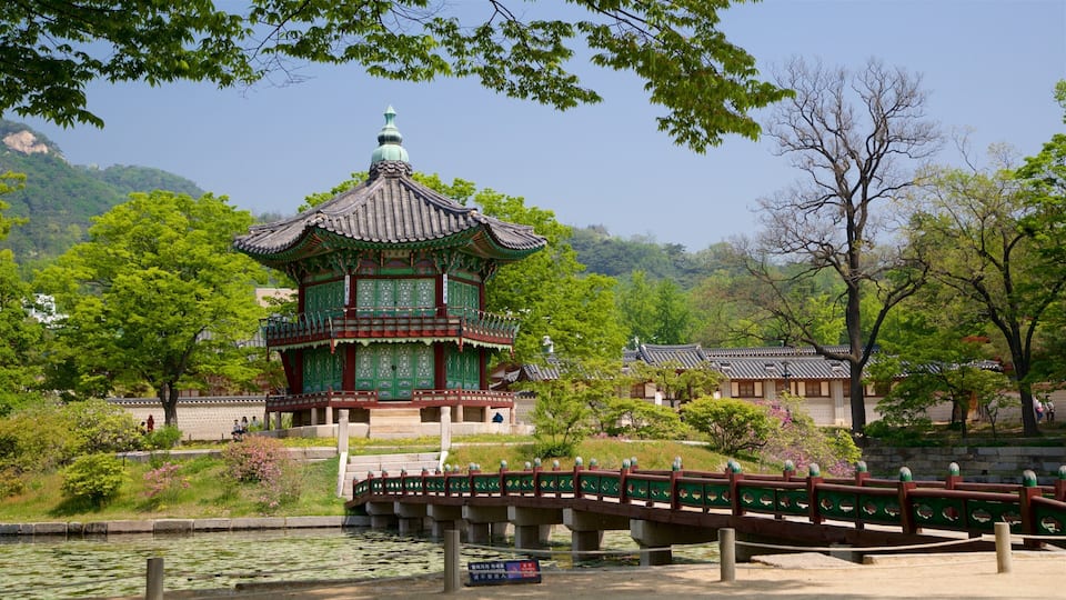 Gyeongbok Palace showing heritage architecture, a park and a bridge