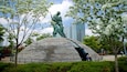 War Memorial of Korea featuring a park, a city and a statue or sculpture